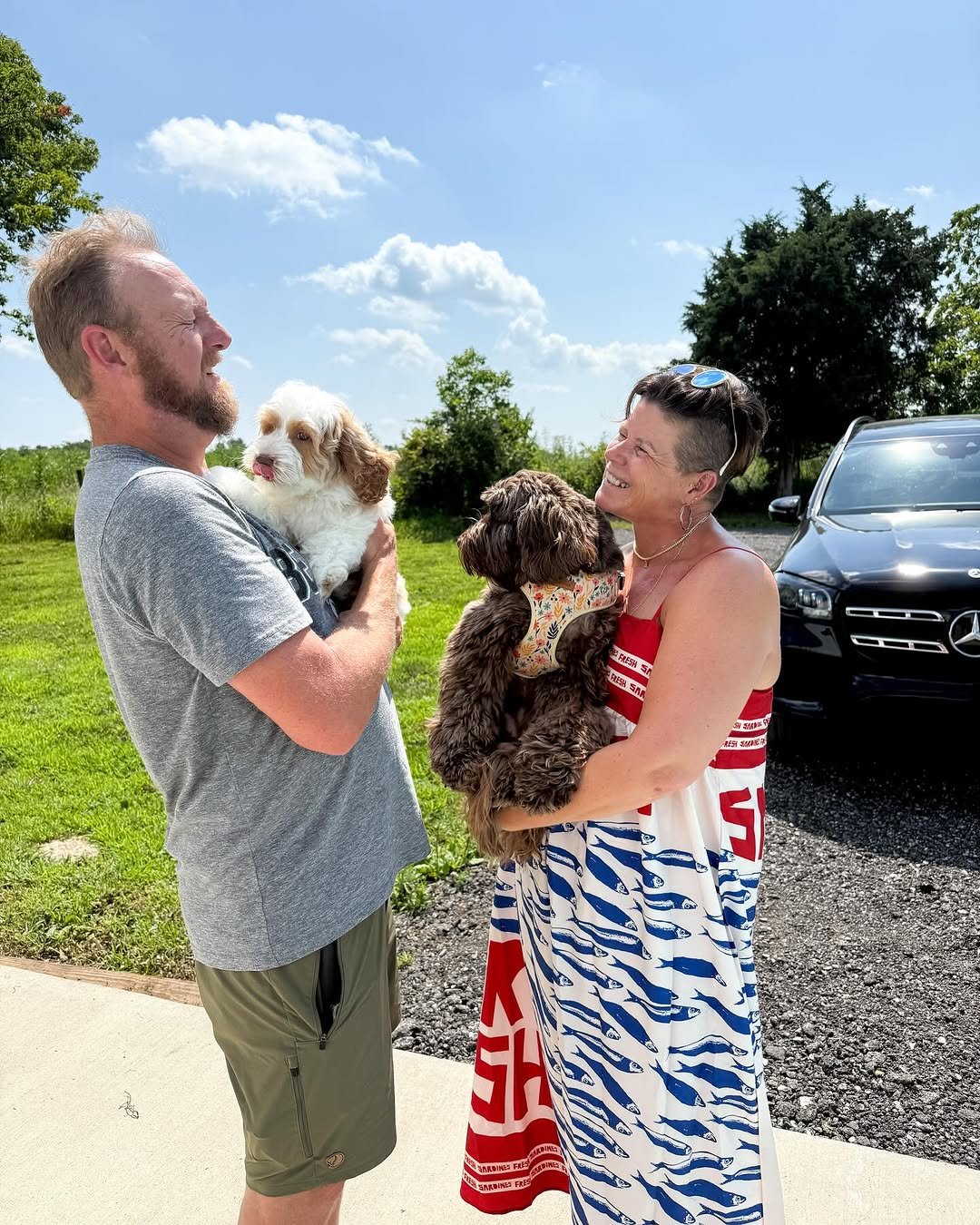Goldendoodle puppy arriving at its new home with the delivery team
