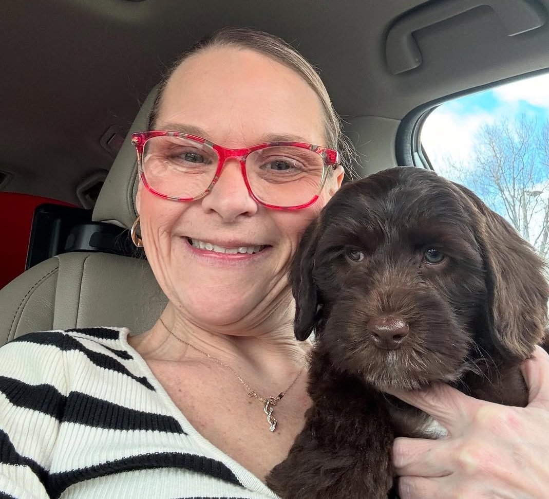 Furry Friends HQ breeder on a support video call with a puppy family